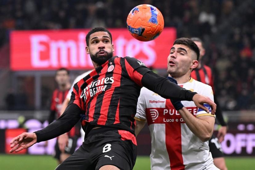 AC Milan's English midfielder #08 Ruben Loftus-Cheek (L) fights for the ball with Genoa's Mexican defender #22 Johan Vazquez during the Italian Serie A football match between AC Milan and Genoa at San Siro stadium in Milan, northern Italy, on January 8, 2025.  Stefano Rellandini / AFP