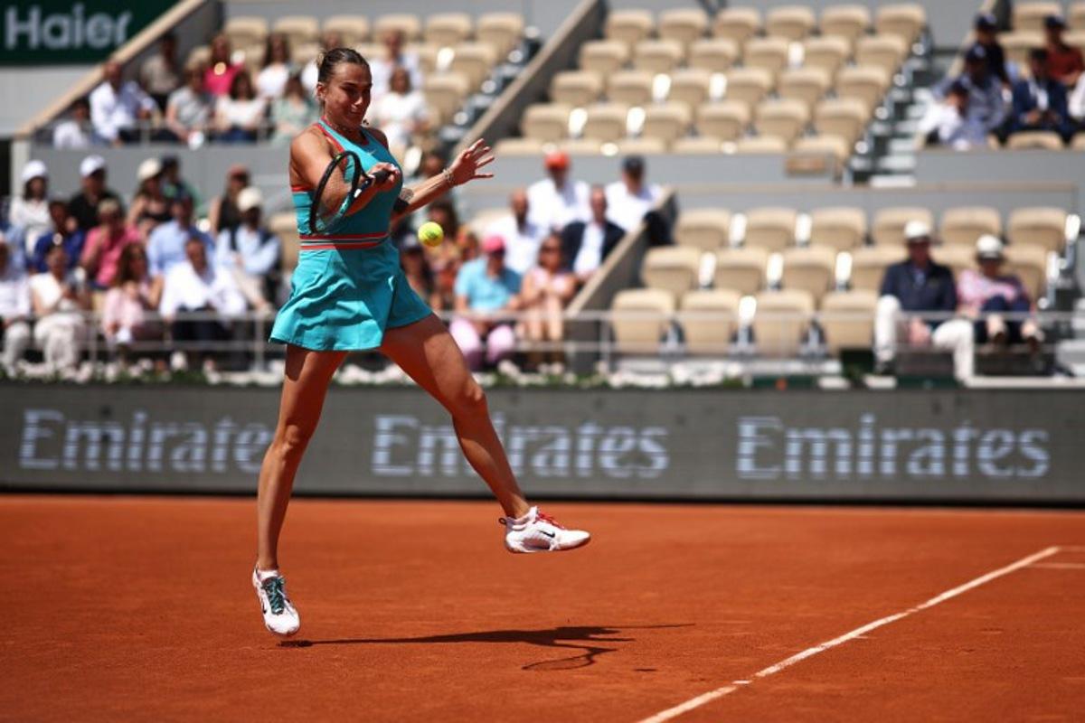 Belarus' Aryna Sabalenka plays a forehand return to China's Zheng Qinwen during their quarter-final women's singles match on day 10 of the French Open tennis tournament on Court Philippe-Chatrier at the Roland-Garros Complex in Paris on June 3, 2025.  Anne-Christine POUJOULAT / AFP