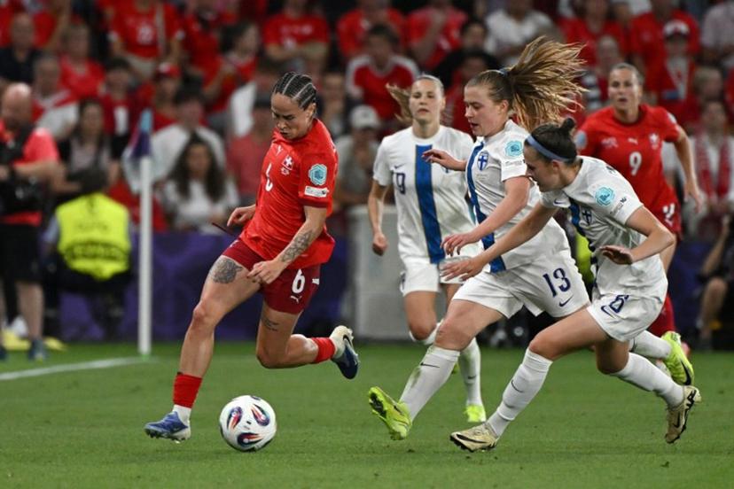 Switzerland's forward #06 Geraldine Reuteler, runs with the ball during the UEFA Women's Euro 2025 Group A football match between Finland and Switzerland at the Stade de Geneve in Geneva, on July 10, 2025.  Miguel MEDINA / AFP