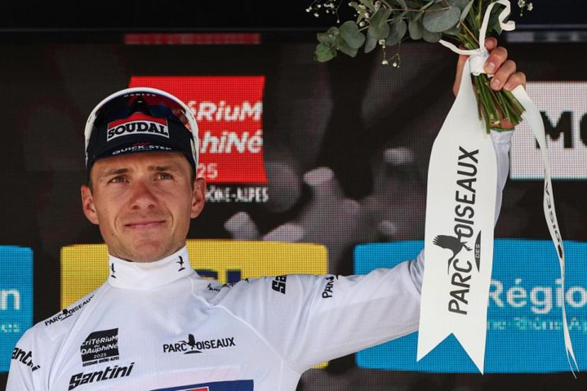 Soudal Quick-Step's Belgian rider Remco Evenepoel wearing the best young rider's white jersey celebrates on the podium of the 1st stage of the 77th edition of the Criterium du Dauphine cycling race, 195,8 km between Domérat and Montlucon, on June 8, 2025.  Anne-Christine POUJOULAT / AFP