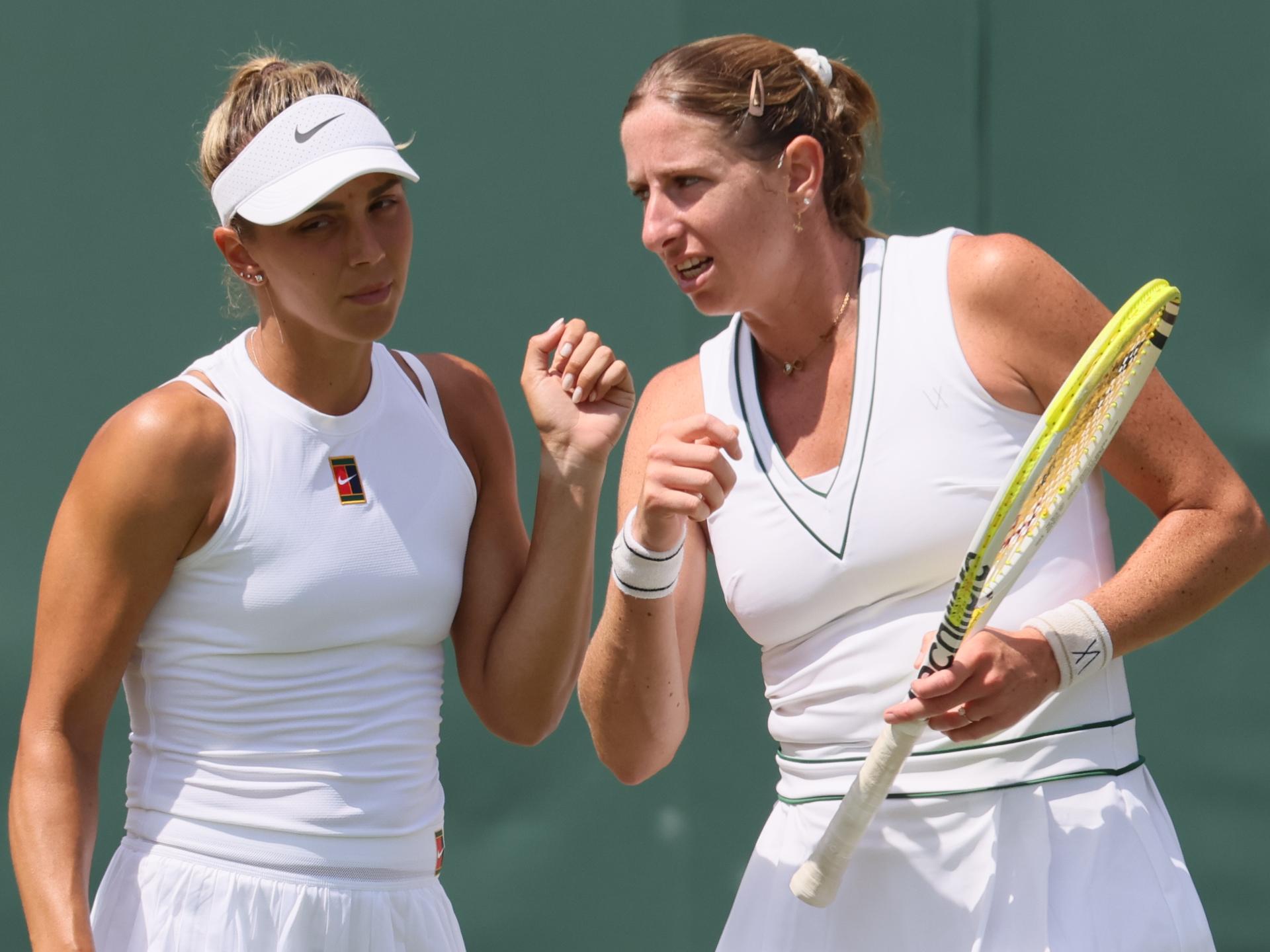 Romanian Jaqueline Cristian and Belgian Magali Kempen pictured during a doubles tennis match between Romanian-Belgian pair Cristian-Kempen and Hungarian-Brazilian pair Babos-Stefani, in the first round of the women's doubles at the 2025 Wimbledon grand slam tournament, Thursday 03 July 2025 at the All England Tennis Club, in South-West London, Britain. BELGA PHOTO BENOIT DOPPAGNE