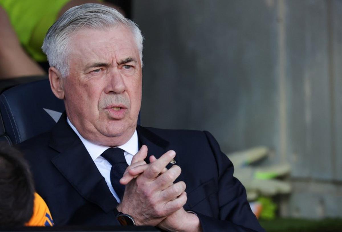 Real Madrid's Italian coach Carlo Ancelotti looks on prior the Spanish league football match between FC Barcelona and Real Madrid CF at Estadi Olimpic Lluis Companys in Barcelona, on May 11, 2025.  LLUIS GENE / AFP