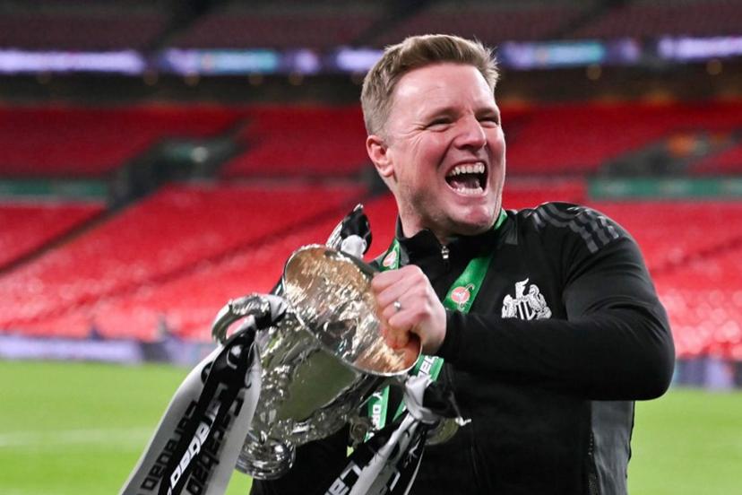 Newcastle United's English head coach Eddie Howe celebrates with the League Cup trophy after winning the English League Cup final football match between Liverpool and Newcastle United at Wembley Stadium, north-west London on March 16, 2025. Newcastle United wins English League Cup 2 -1 against Liverpool. Glyn KIRK / AFP