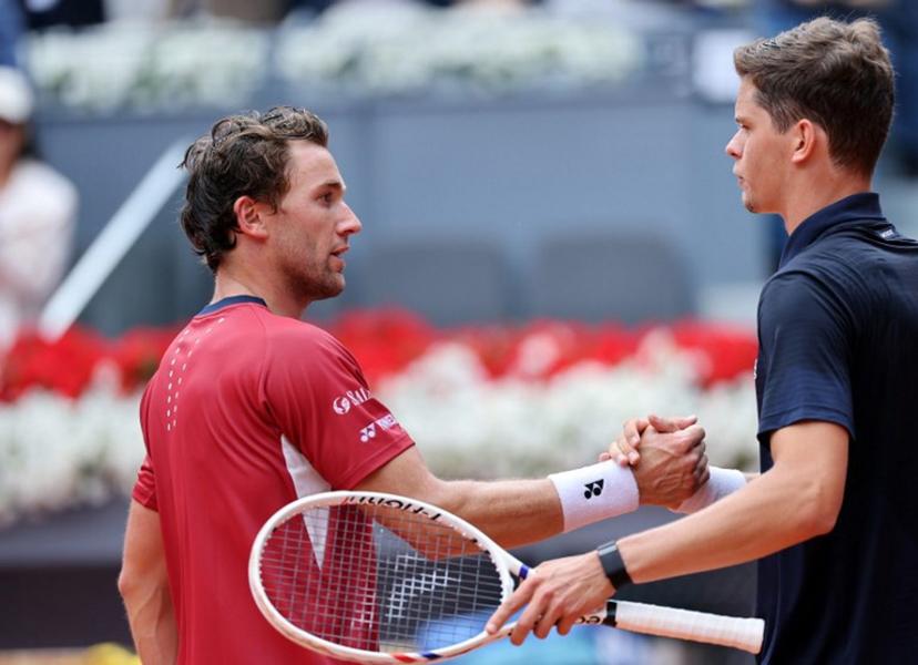 Belgium's Alexander Blockx shakes hands with Norway's Casper Ruud after beating him during their 2026 ATP Tour Madrid Open tennis tournament quarter-final singles match at the Caja Magica in Madrid, on April 30, 2026.  Thomas COEX / AFP