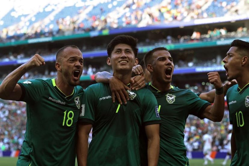 Bolivia's forward #07 Miguel Terceros (2nd L) celebrates with teammates midfielder #18 Juan Godoy (L), midfielder #14 Robson Matheus and forward #10 Ramiro Vaca after scoring a penalty kick during the 2026 FIFA World Cup qualifiers semi-final playoff football match between Bolivia and Suriname at the BBVA Stadium in Guadalupe, Mexico on March 26, 2026.  Julio Cesar AGUILAR / AFP