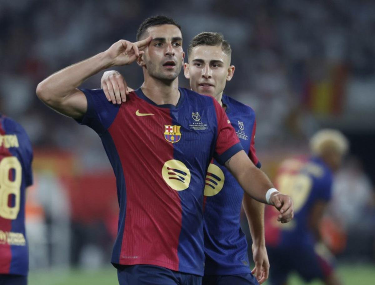 Barcelona's Spanish forward #07 Ferran Torres celebrates with Barcelona's Spanish midfielder #16 Fermin Lopez (R) after scoring his team's second goal during their Spanish Cup, Copa del Rey (King's Cup) final football match between FC Barcelona and Real Madrid CF at La Cartuja stadium in Seville on April 26, 2025.  Pierre-Philippe MARCOU / AFP