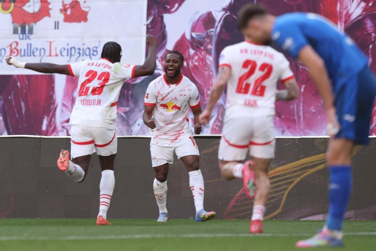 Leipzig's German midfielder #17 Ridle Baku (C) celebrates scoring his team's second goal 2:1 during the German first division Bundesliga football match between RB Leipzig and TSG 1899 Hoffenheim in Leipzig, eastern Germany, on April 5, 2025.  RONNY HARTMANN / AFP