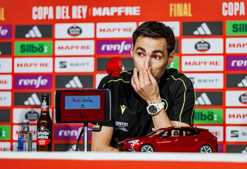 This handout picture taken and released by the Spanish Royal Football Federation (RFEF) on April 25, 2025 shows Spanish referee Ricardo De Burgos Bengoechea in tears during a press conference ahead of the King's Cup final, at La Cartuja stadium in Seville on April 25, 2025. Referee of the final of the King's Cup between FC Barcelona and Real Madrid on April 26, 2025 Ricardo de Burgos Bengoechea denounced, in tears, the constant pressure from Real Madrid TV and its consequences at the family level. Pablo GARCIA / RFEF / AFP