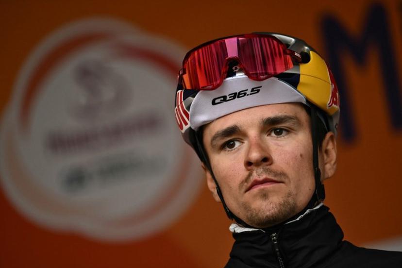Team Q36.5's British rider Thomas Pidcock stands on stage before the start of the Milan - Sanremo one-day classic cycling race, in Pavia, near Milan, on March 22, 2025.  Marco BERTORELLO / AFP