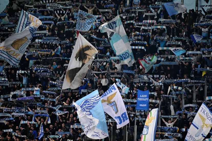 Lazio's supporters cheer their team before the Italian Serie A football match between Lazio and Roma at the Olympic Stadium in Rome on April 13, 2025.  Tiziana FABI / AFP