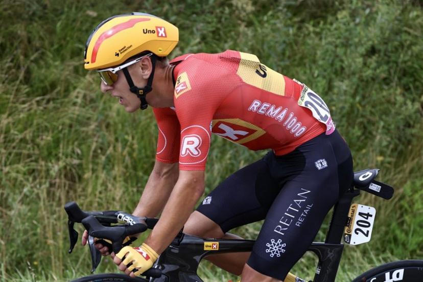 Uno-X Mobility team's Norwegian rider Tobias Halland Johannessen cycles ahead of the pack of riders (peloton) during the 13th stage of the 111th edition of the Tour de France cycling race, 165,3 km between Agen and Pau, southwestern France, on July 12, 2024.  Anne-Christine POUJOULAT / AFP