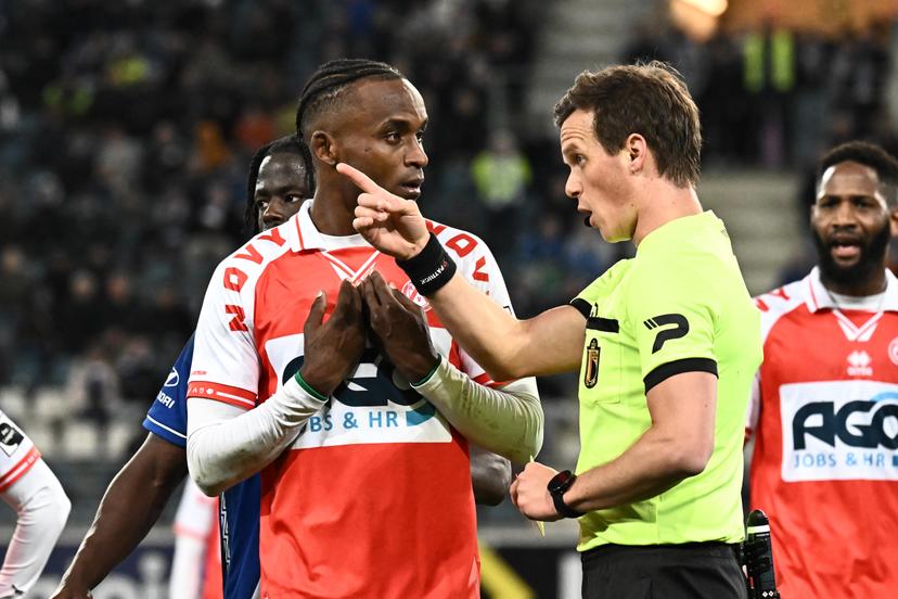 Kortrijk's James Ndjeungoue receives a red card from referee Kevin Van Damme during a soccer game between KAA Gent and KV Kortrijk, Sunday 16 March 2025 in Gent, on day 30 of the 2024-2025 season of the "Jupiler Pro League" first division of the Belgian championship. BELGA PHOTO MAARTEN STRAETEMANS