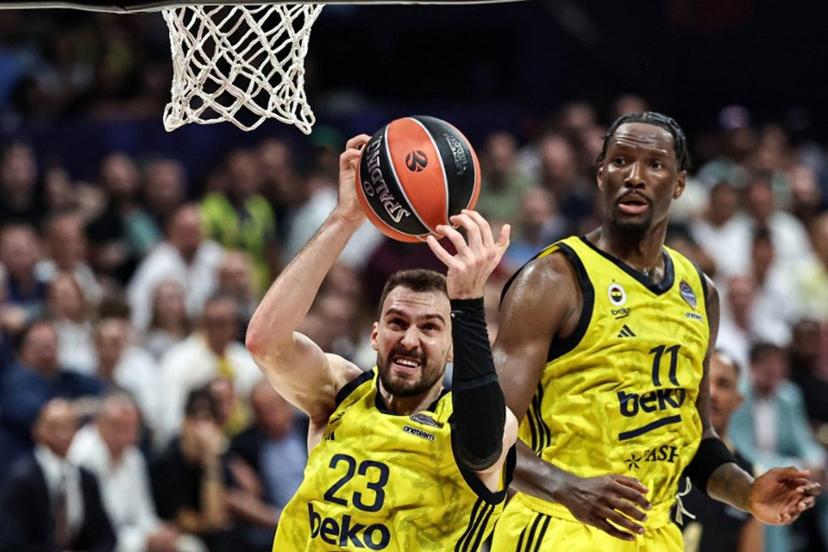 Fenerbahce's Serbian forward #23 Marko Guduric catches the ball during the Euroleague Basketball final match between Fenerbahce Beko Istanbul and AS Monaco at Etihad Arena in Abu Dhabi on May 25, 2025.  Fadel SENNA / AFP