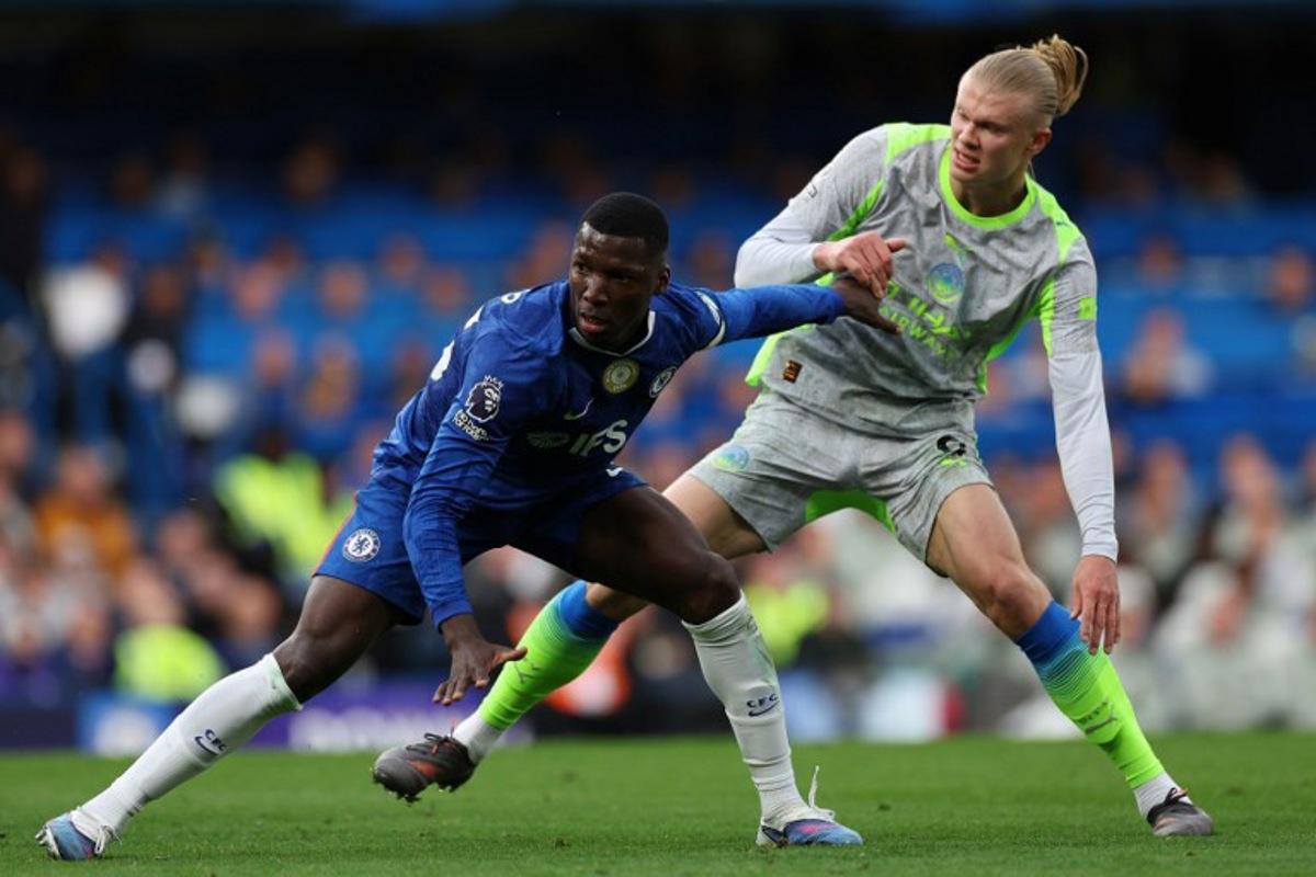 Chelsea's Ecuadorian midfielder #25 Moises Caicedo (L) and Manchester City's Norwegian striker #09 Erling Haaland compete during the English Premier League football match between Chelsea and Manchester City at Stamford Bridge in London on April 12, 2026.  Adrian Dennis / AFP