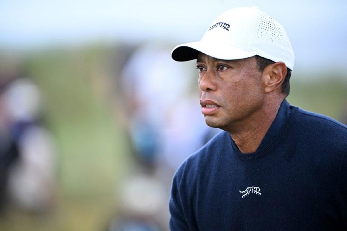 (FILES) US golfer Tiger Woods reacts after driving from the 4th tee during his second round, on day two of the 152nd British Open Golf Championship at Royal Troon on the south west coast of Scotland on July 19, 2024. Golf superstar Tiger Woods was involved in a car crash in Florida on March 27, 2026, US media reports citing local law enforcement said. There was no immediate word on Woods' condition following the incident in Jupiter Island, ABC television reported. NBC local news affiliate WPTV showed a picture of the crash scene showing a sports utility vehicle flipped onto its side.  ANDY BUCHANAN / AFP