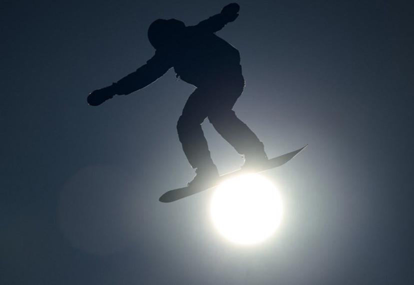 This handout photo taken and received from the OIS/IOC on January 25, 2024 shows the silhouette of Romain Allemand of France competing in the Snowboard Men's Slopestyle during the Gangwon 2024 Winter Youth Olympic Games in Gangwon.  Jonathan NACKSTRAND / OIS/IOC / AFP