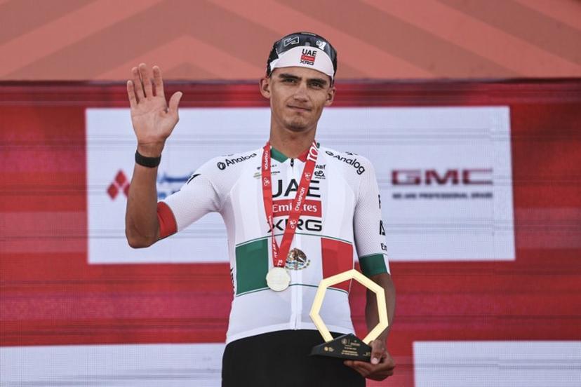 UAE Team Emirates's Mexican rider Isaac Del Toro Romero celebrates with his trophy after winning the first stage of the UAE Tour cycling event from Madinat Zayed Majlis to Liwa Palace in Abu Dhabi on February 16, 2026.  Fadel SENNA / AFP