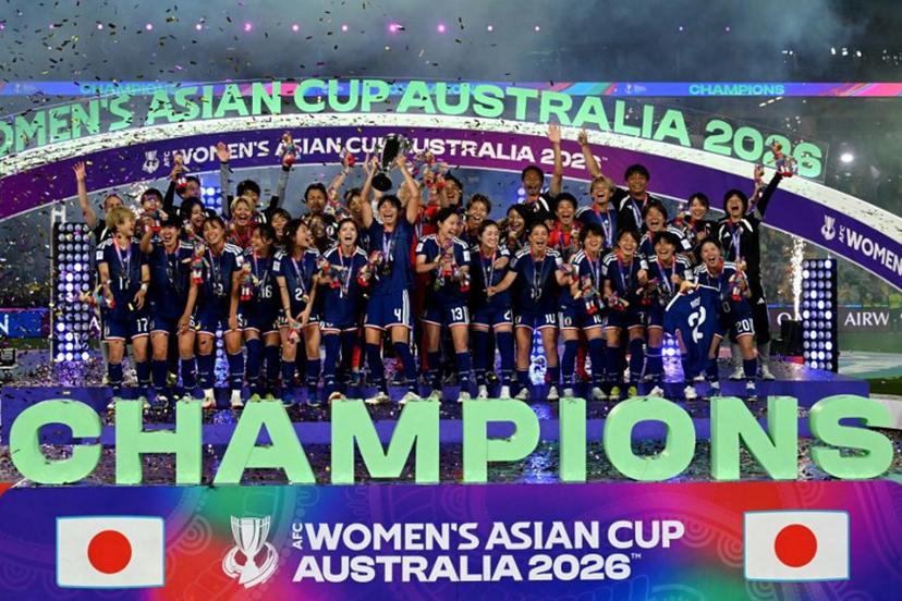 Japan's team celebrate with the trophy after winning the final of the AFC Women's Asian Cup Australia 2026 football tournament between Australia and Japan at Stadium Australia in Sydney on March 21, 2026.  Saeed Khan / AFP