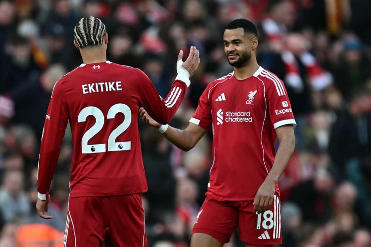 Liverpool's Dutch striker #18 Cody Gakpo (R) celebrates with Liverpool's French striker #22 Hugo Ekitike (L) after scoring their fourth goal during the English Premier League football match between Liverpool and West Ham United at Anfield in Liverpool, north west England on February 28, 2026.  Paul ELLIS / AFP