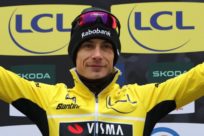 Team Visma - Lease a Bike's Danish rider Jonas Vingegaard celebrates his overall leader yellow jersey on the podium after the 7th stage of the Paris-Nice cycling race, 47 km between Le Broc and Isola-Village, on March 14, 2026. Due to deteriorating weather conditions, the route of stage 7 has been changed to a 47 km race from Le Broc to Isola. Anne-Christine POUJOULAT / AFP