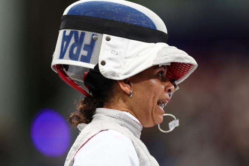 France's Ysaora Thibus reacts as she competes against Canada's Yunjia Zhang in the women's foil team round of 8 bout during the Paris 2024 Olympic Games at the Grand Palais in Paris, on August 1, 2024.  Franck FIFE / AFP