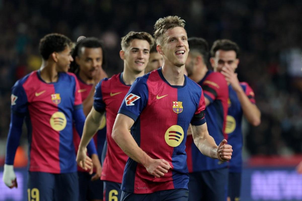Barcelona's Spanish forward #20 Daniel Olmo celebrates after scoring a penalty kick and his team's second goal during the Spanish league football match between FC Barcelona and CA Osasuna at Estadi Olimpic Lluis Companys in Barcelona on March 27, 2025.  LLUIS GENE / AFP
