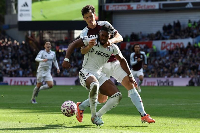 Aston Villa's Spanish defender #14 Pau Torres (R) vies with Fulham's Spanish midfielder #11 Adama Traore during the English Premier League football match between Aston Villa and Fulham at Villa Park in Birmingham, central England on September 28, 2025.  Darren Staples / AFP