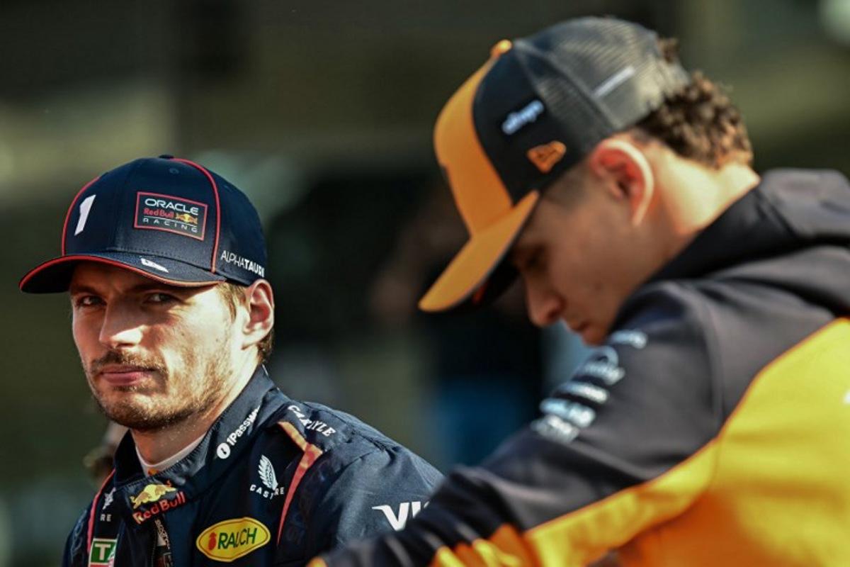 Red Bull Racing's Dutch driver Max Verstappen (L) and McLaren's British driver Lando Norris arrive to take part in the drivers' parade ahead of the Abu Dhabi Formula One Grand Prix at the Yas Marina Circuit in Abu Dhabi on December 7, 2025.  Giuseppe CACACE / AFP