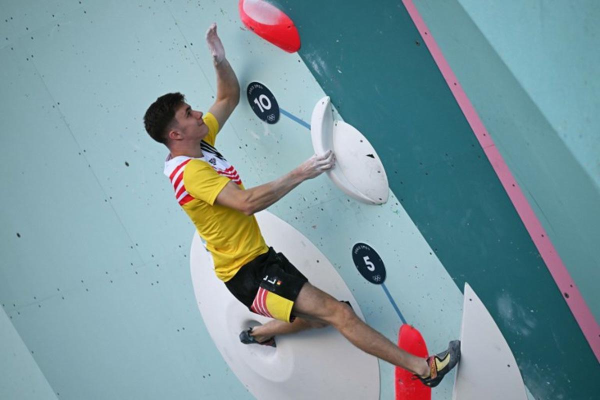 Belgium's Hannes Van Duysen competes in the men's sport climbing boulder semi final during the Paris 2024 Olympic Games at Le Bourget Sport Climbing Venue in Le Bourget on August 5, 2024.  Fabrice COFFRINI / AFP