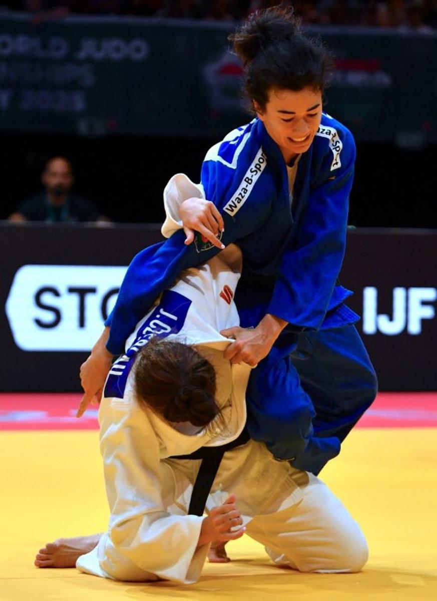 Hungary's Jennifer Czerlau competes against Belgium's Gabriella Willems in the women's -70kgs qualification round of the Judo World Championships at Papp Laszlo Arena in Budapest, Hungary, on June 17, 2025.  Ferenc ISZA / AFP