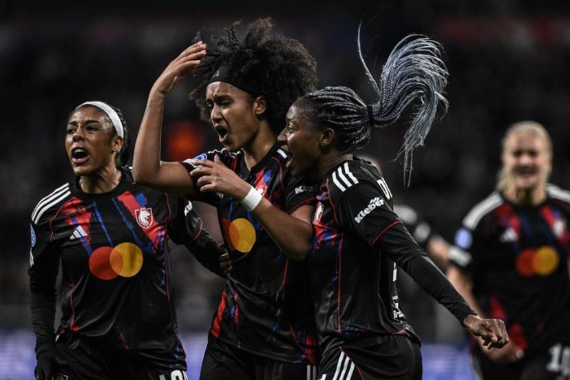 Lyon's US midfielder #20 Lily Yohannes (C) celebrates with teammates after scoring her team's first goal during the UEFA Women's Champions League quarter final second leg football match between OL Lyonnes (Lyon) and VfL Wolfsburg at the Groupama stadium in Decines-Charpieu, central-eastern France, on April 2, 2026.  JEFF PACHOUD / AFP