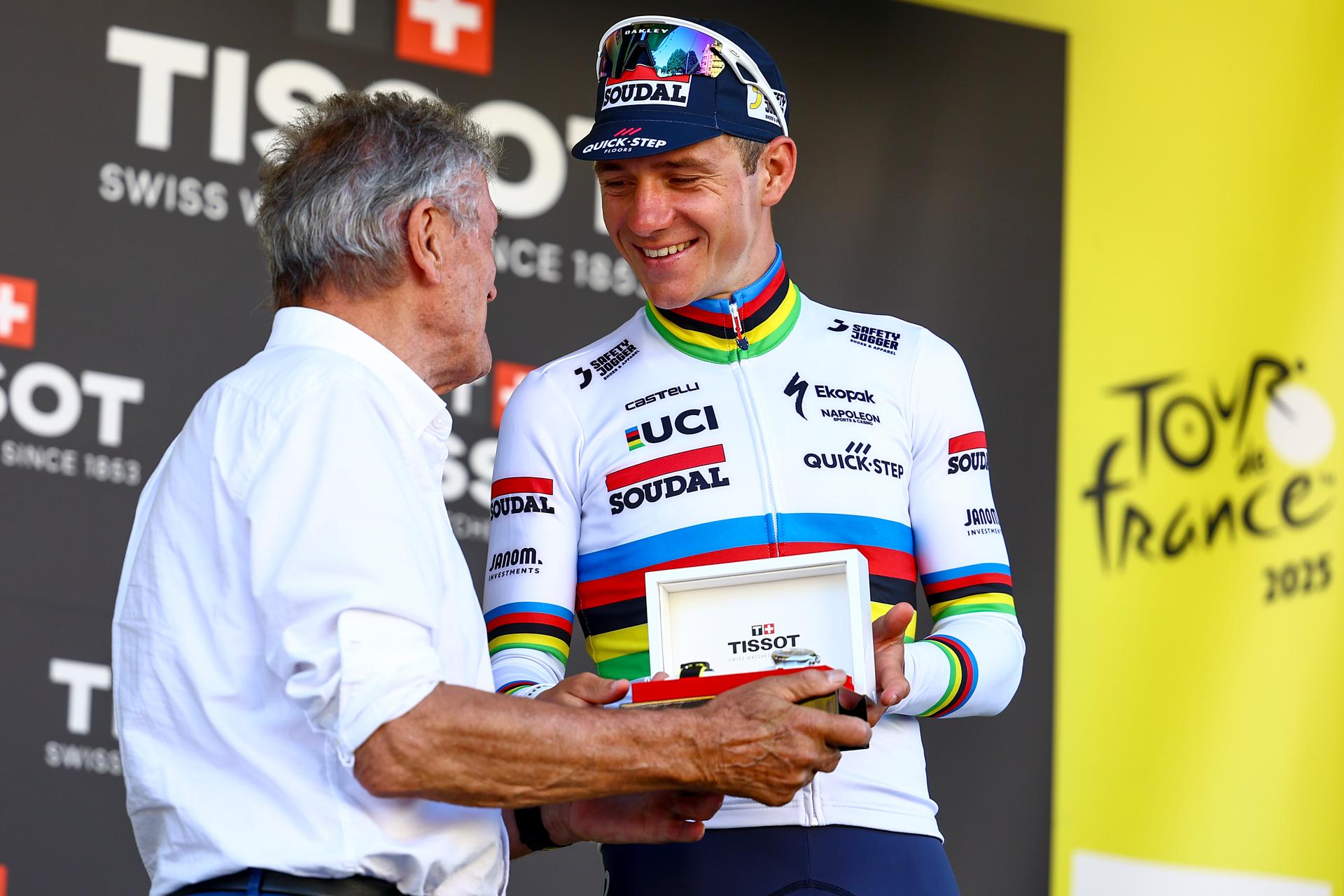 Belgian Remco Evenepoel of Soudal Quick-Step celebrates on the podium after winning stage five of the 2025 Tour de France cycling, a 33km time trial in Caen, France on Wednesday 09 July 2025. The 112th edition of the Tour de France starts on Saturday 5 July in Lille, France, and will finish in Paris, France on the 27th of July. BELGA PHOTO DAVID PINTENS