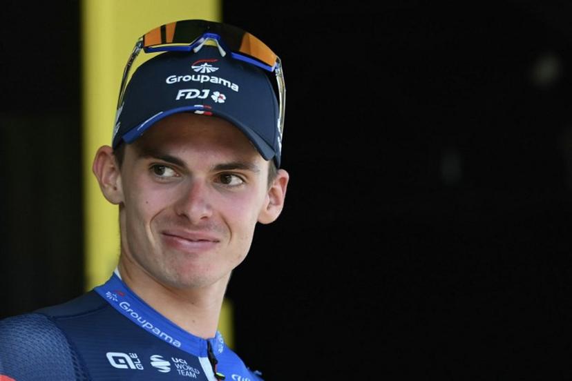 Groupama - FDJ team's French rider Romain Gregoire celebrates on the podium with the most combative rider's award after the 17th stage of the 111th edition of the Tour de France cycling race, 177,8 km between Saint-Paul-Trois-Chateaux and Superdevoluy, southern France, on July 17, 2024.  Marco BERTORELLO / AFP