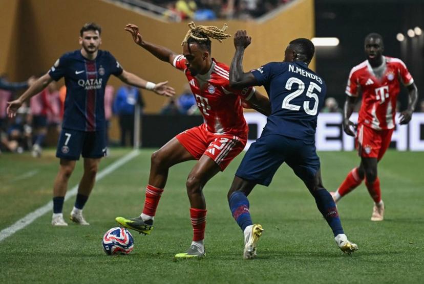 Bayern Munich's French defender #23 Sacha Boey and Paris Saint-Germain's Portuguese defender #25 Nuno Mendes fight for the ball during the FIFA Club World Cup 2025 quarterfinal football match between France's Paris Saint-Germain and Germany's Bayern Munich at the Mercedes-Benz Stadium in Atlanta on July 5, 2025.  Paul ELLIS / AFP