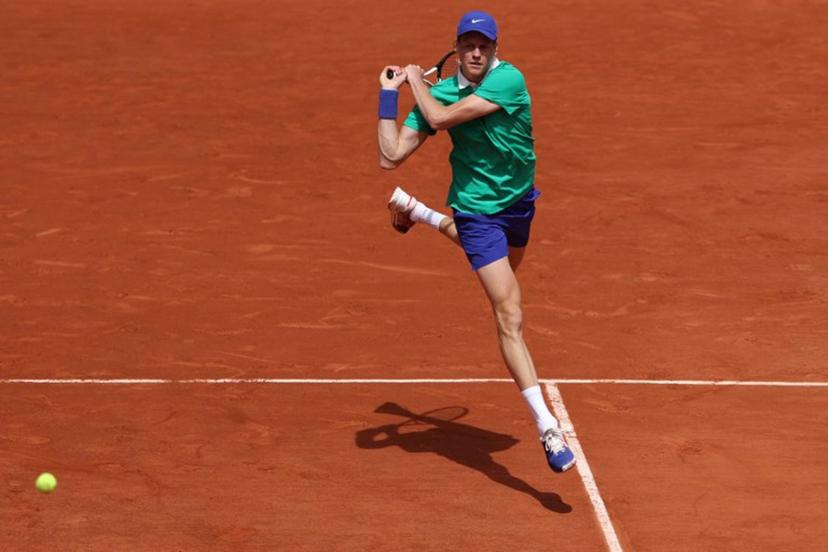 Italy's Jannik Sinner plays a backhand return to France's Richard Gasquet during their men's singles match on day 5 of the French Open tennis tournament on Court Philippe-Chatrier at the Roland-Garros Complex in Paris on May 29, 2025.  ALAIN JOCARD / AFP