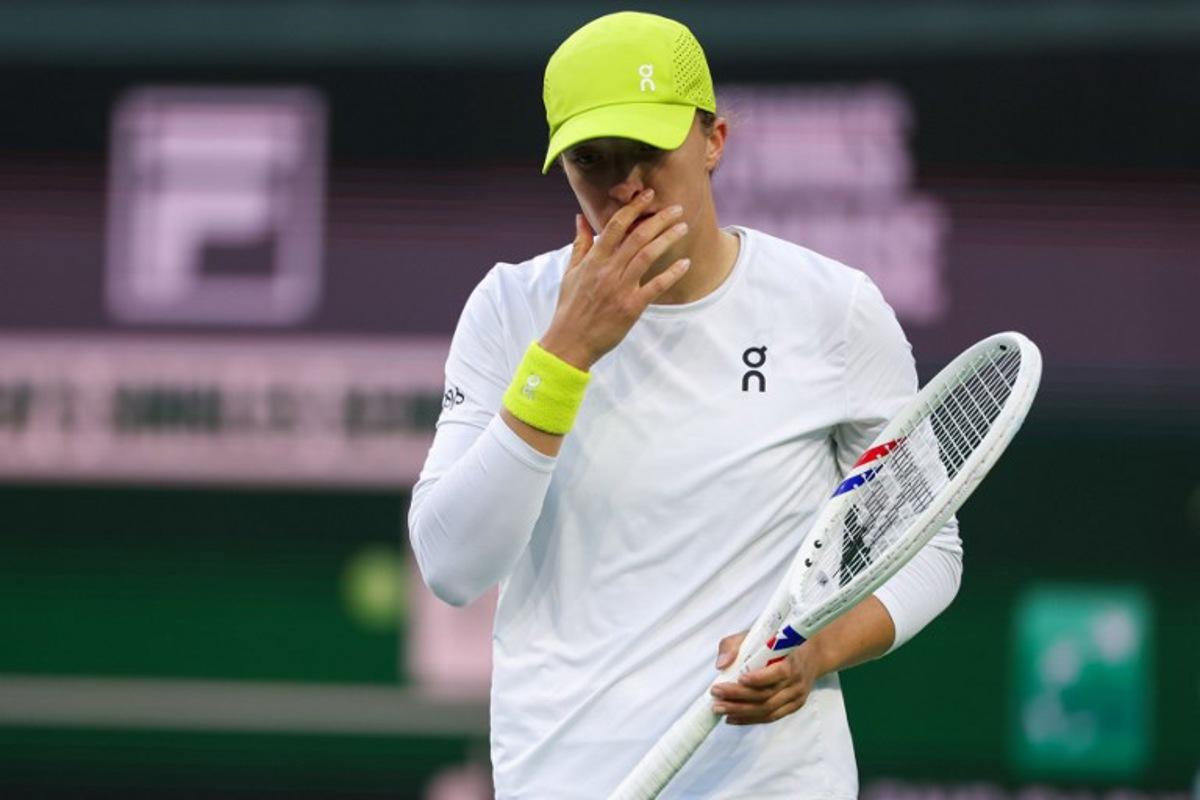 Poland's Iga Swiatek reacts while playing against Russia's Mirra Andreeva during their women's singles semi-final tennis match at the BNP Paribas Open at the Indian Wells Tennis Garden in Indian Wells, California, on March 14, 2025.  Patrick T. Fallon / AFP