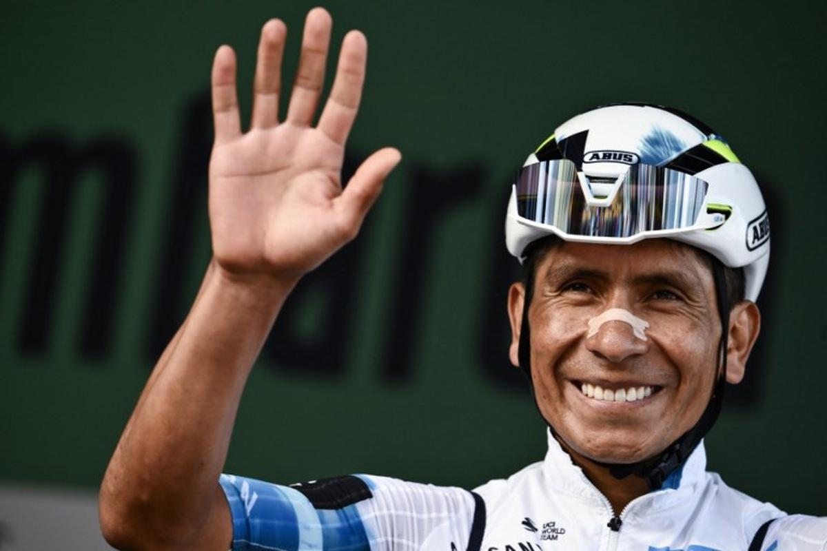 (FILES) Movistar Team's Colombian riderNairo Quintana looks on from the sign-in podium ahead of the 119th edition of the Giro di Lombardia (Tour of Lombardy), a 238km cycling race from Como to Bergamo on October 11, 2025. Colombian cyclist Nairo Quintana, one of Latin America's most successful riders and a prominent figure in the peloton, announced on March 22, 2026, that he will retire at the end of the 2026 season. Marco BERTORELLO / AFP