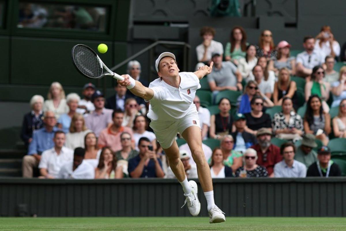 Italy's Jannik Sinner plays a forehand return to Australia's Aleksander Vukic during their men's singles second round tennis match on the fourth day of the 2025 Wimbledon Championships at The All England Lawn Tennis and Croquet Club in Wimbledon, southwest London, on July 3, 2025.  Adrian Dennis / AFP