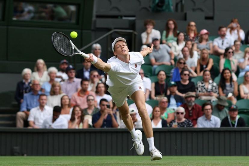 Italy's Jannik Sinner plays a forehand return to Australia's Aleksander Vukic during their men's singles second round tennis match on the fourth day of the 2025 Wimbledon Championships at The All England Lawn Tennis and Croquet Club in Wimbledon, southwest London, on July 3, 2025.  Adrian Dennis / AFP