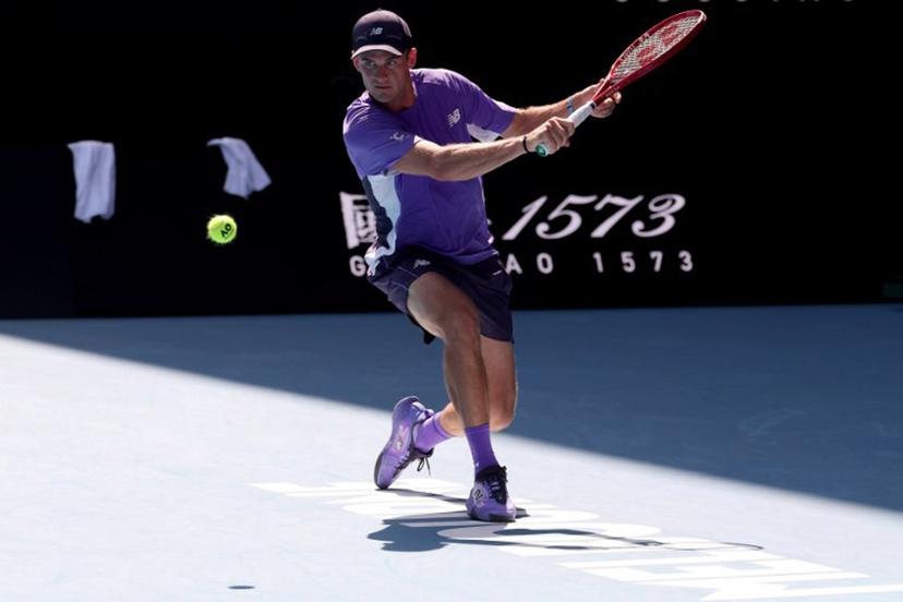 USA's Tommy Paul hits a return to Spain's Carlos Alcaraz during their men's singles match on day eight of the Australian Open tennis tournament in Melbourne on January 25, 2026.   DAVID GRAY / AFP