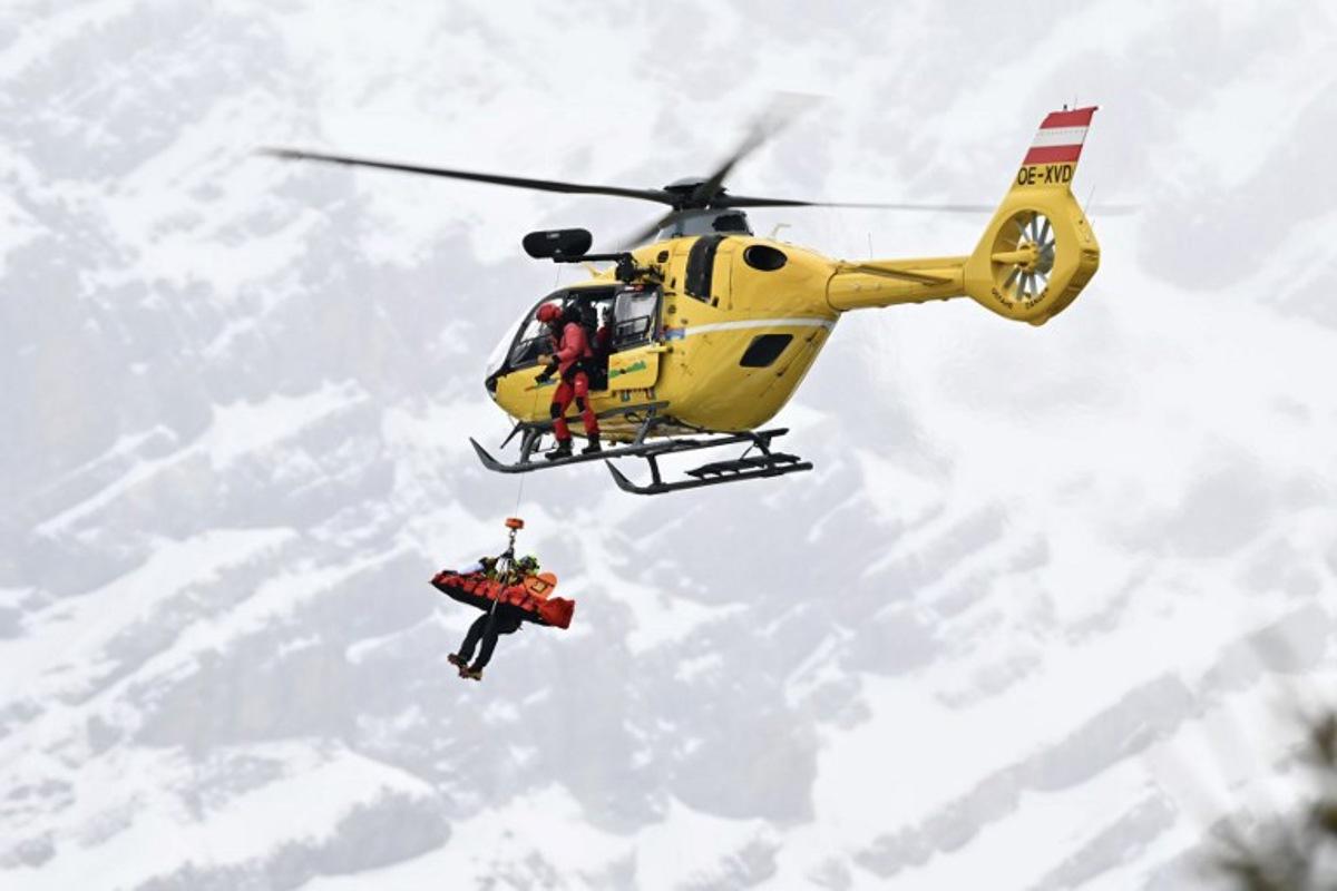 Norway's Fredrik Moeller is airlifted off the slope after crashing in the first official training for the men's downhill alpine skiing event ahead of the Milano Cortina 2026 Winter Olympic Games at the Stelvio Ski Centre in Bormio (Valtellina) on February 4, 2026.  Fabrice COFFRINI / AFP
