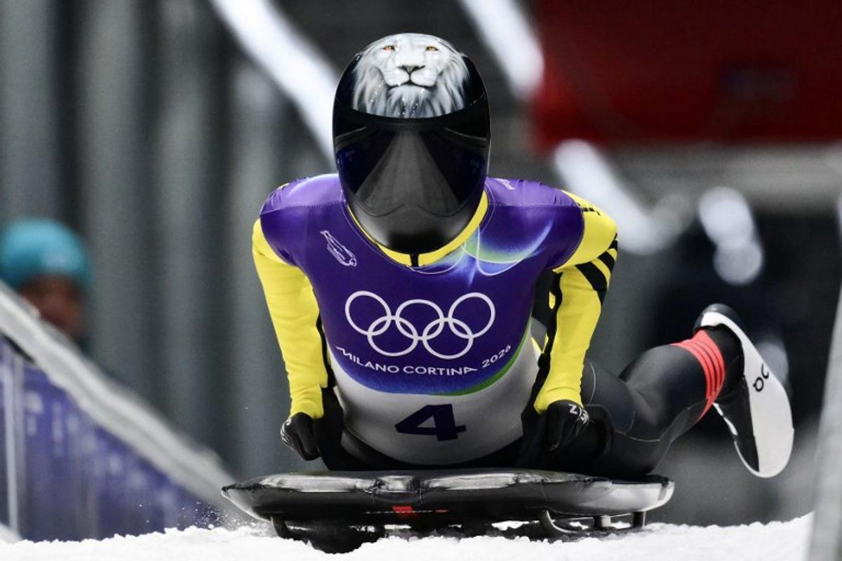 Belgium's Kim Meylemans arrives to the finish area in the skeleton women's heat 3 at Cortina Sliding Centre during the Milano Cortina 2026 Winter Olympic Games in Cortina d'Ampezzo on February 14, 2026.  Stefano RELLANDINI / AFP