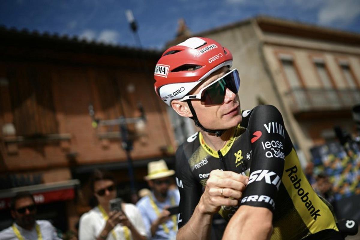 Team Visma - Lease a bike team's Danish rider Jonas Vingegaard looks on as he awaits the start of the 15th stage of the 112th edition of the Tour de France cycling race, 169.3 km between Muret and Carcassonne, southwestern France, on July 20, 2025.  Loic VENANCE / AFP