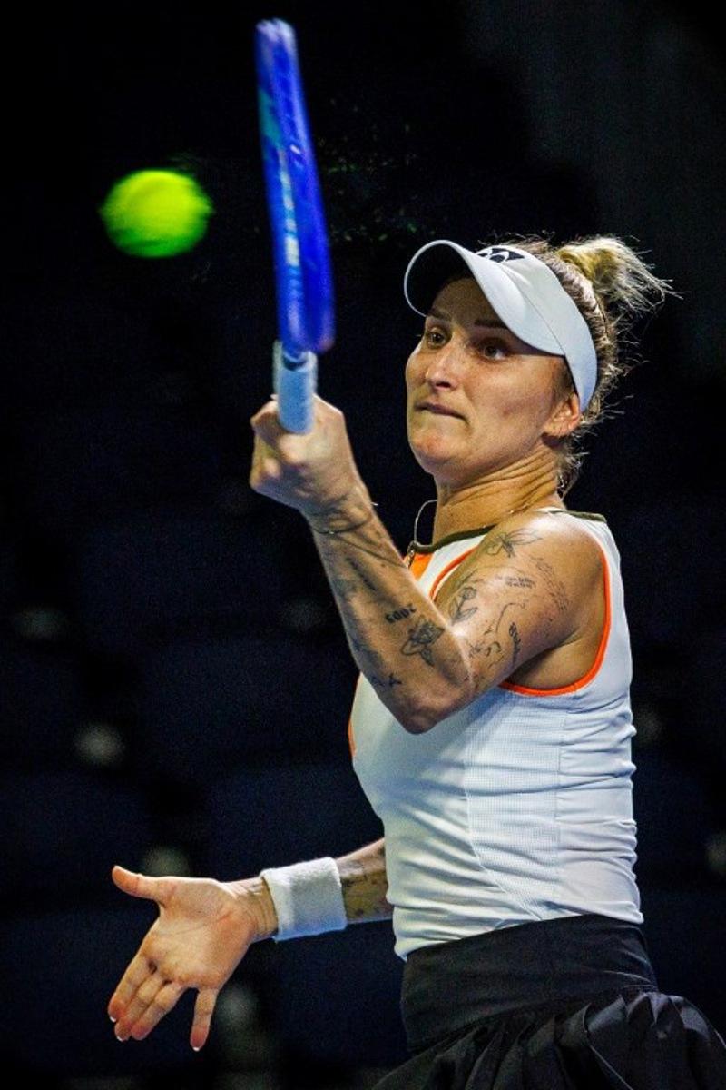 Czech Republic's Marketa Vondrousova hits a return against Poland's Magdalena Frech during the women's singles match at the Brisbane International tennis tournament in Brisbane on January 5, 2026.  Patrick HAMILTON / AFP