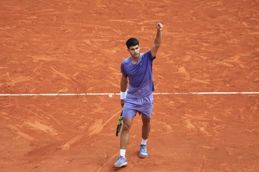 Spain's Carlos Alcaraz reacts after a point as he plays against France's Arthur Fils during the Monte Carlo ATP Masters Series Tournament quarter-final tennis match on the Rainier III court at the Monte Carlo Country Club in Roquebrune-Cap-Martin on April 11, 2025.  Valery HACHE / AFP