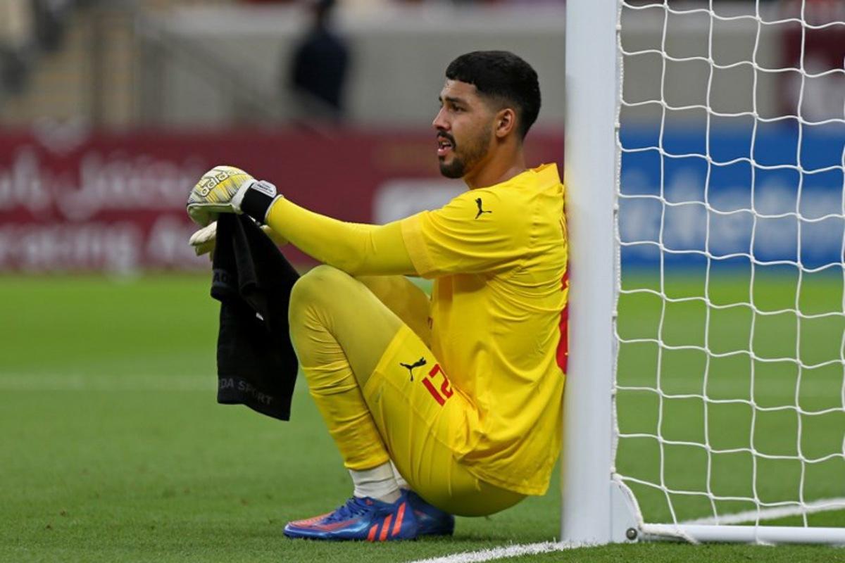 Arabi's goalkeeper Mahmoud Abunada reacts during the Qatar Stars League match between Al-Arabi and Al-Rayyan at the Lusail stadium, on the outskirts of the capital Doha on August 11, 2022.  Mustafa ABUMUNES / AFP