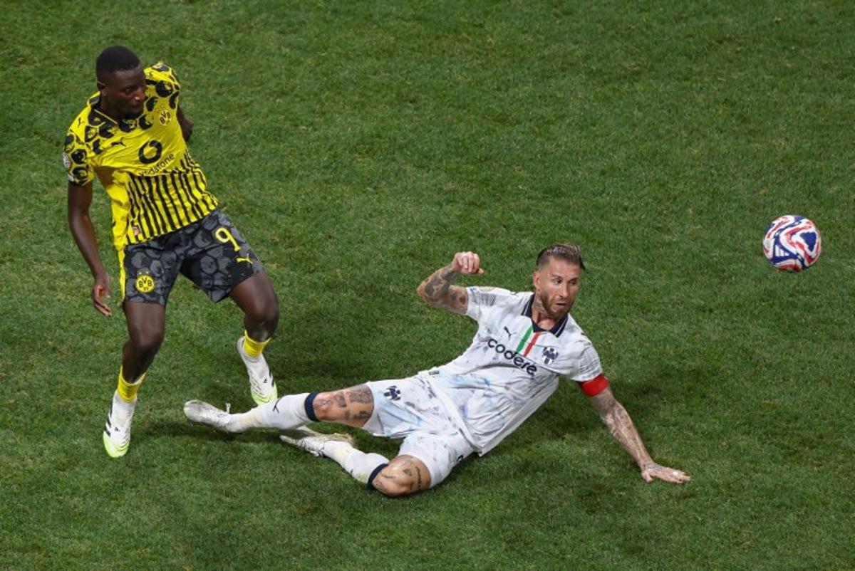 Borussia Dortmund's Guinean forward #09 Serhou Guirassy and Monterrey's Spanish defender #93 Sergio Ramos fight for the ball during the FIFA Club World Cup 2025 round of 16 football match between Germany's Borussia Dortmund and Mexico's Monterrey at the Mercedes-Benz Stadium in Atlanta on July 1, 2025.  Franck FIFE / AFP