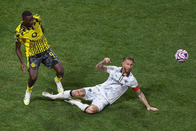 Borussia Dortmund's Guinean forward #09 Serhou Guirassy and Monterrey's Spanish defender #93 Sergio Ramos fight for the ball during the FIFA Club World Cup 2025 round of 16 football match between Germany's Borussia Dortmund and Mexico's Monterrey at the Mercedes-Benz Stadium in Atlanta on July 1, 2025.  Franck FIFE / AFP