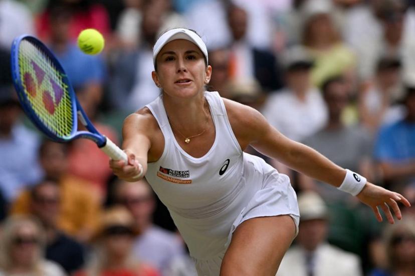 Switzerland's Belinda Bencic plays a forehand return to Russia's Mirra Andreeva during their women's singles quarter-final tennis match on the tenth day of the 2025 Wimbledon Championships at The All England Lawn Tennis and Croquet Club in Wimbledon, southwest London, on July 9, 2025.  Glyn KIRK / AFP