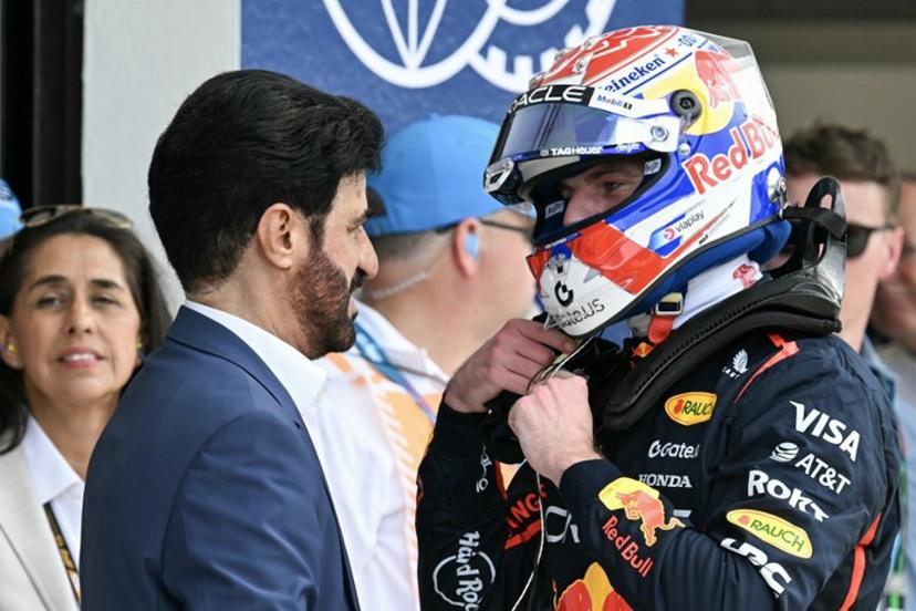 (L-R) FIA President Mohammed Ben Sulayem talks to Red Bull Racing's Dutch driver Max Verstappen after Verstappen won the pole position during the qualifying session for the 2025 Miami Formula One Grand Prix at Miami International Autodrome in Miami Gardens, Florida, on May 3, 2025.   Chandan Khanna / AFP